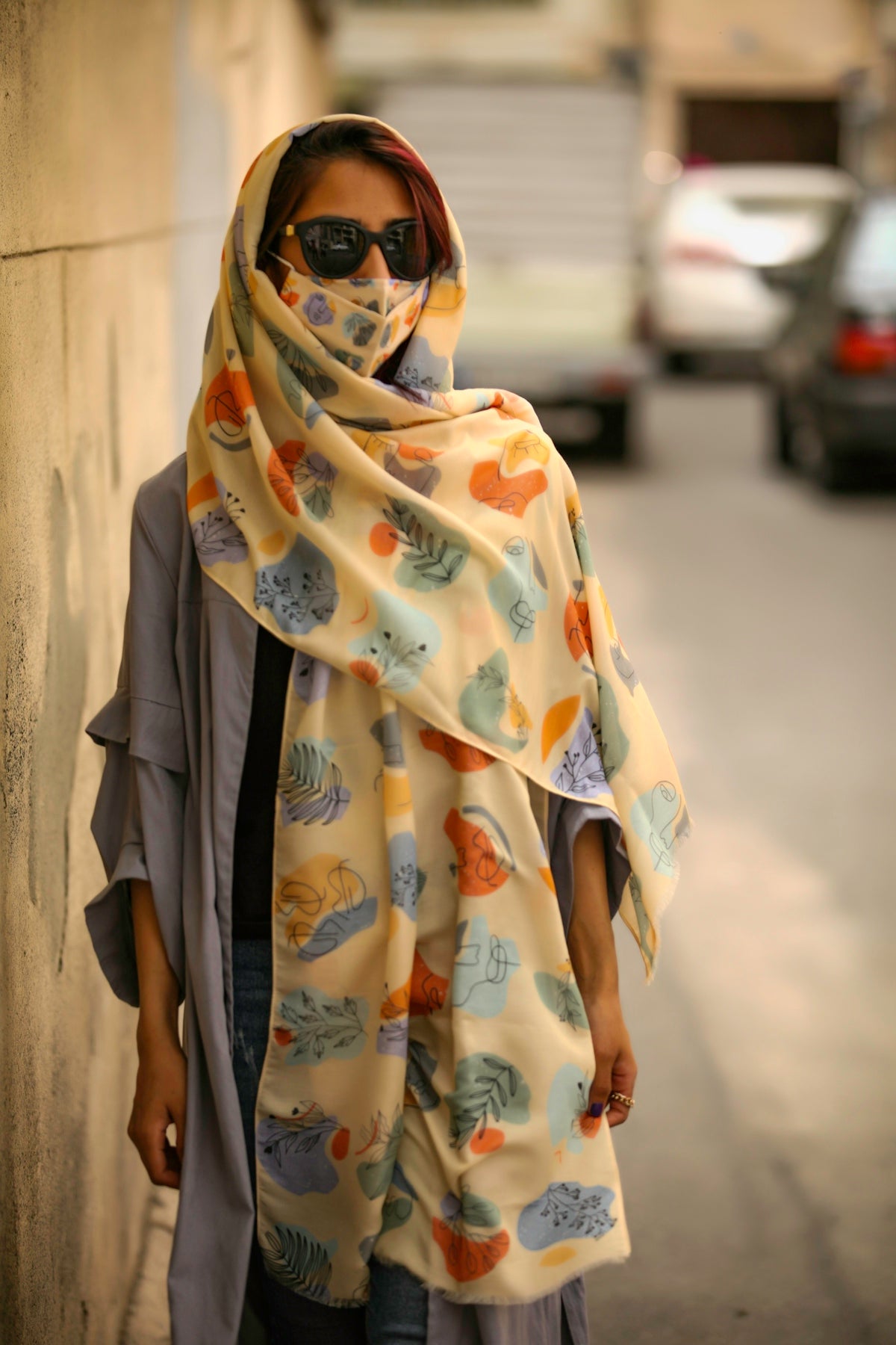 woman in yellow and white floral hijab