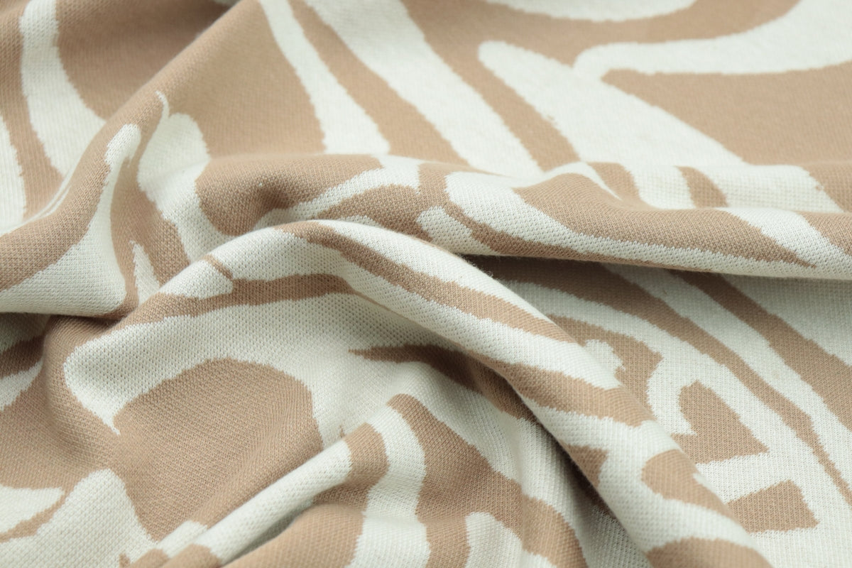 a close up of a brown and white fabric