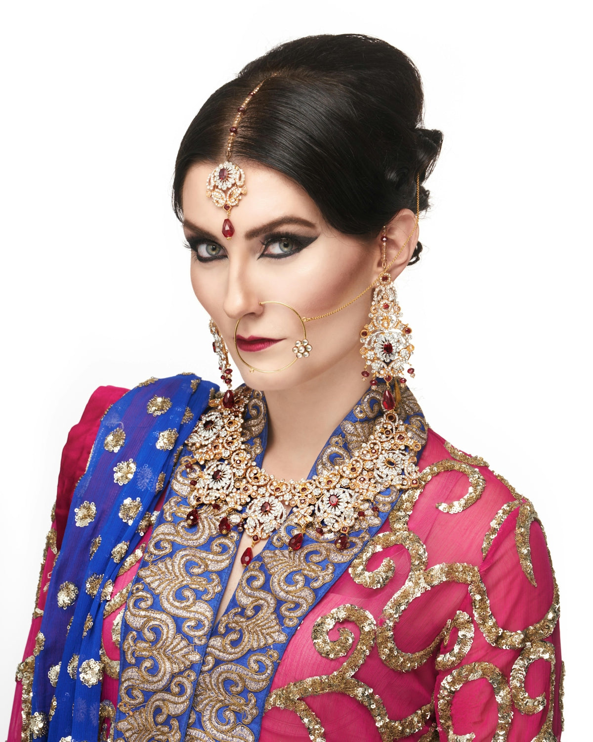 a woman wearing a blue and pink outfit