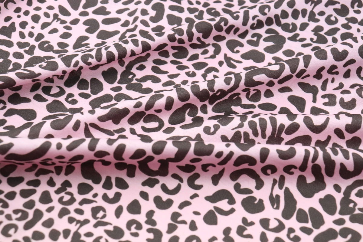 a pink and black animal print fabric