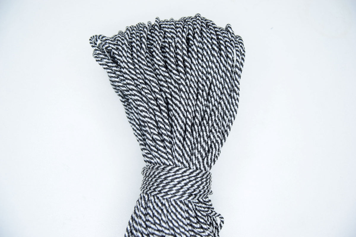 A bundle of black and white twisted rope