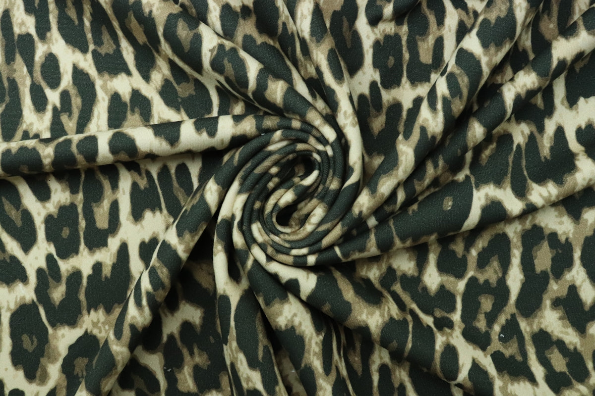 a green and white animal print fabric