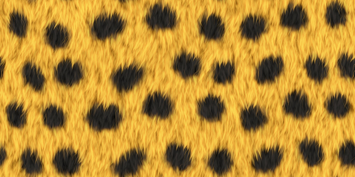 A close-up of a yellow and black spotted animal print.